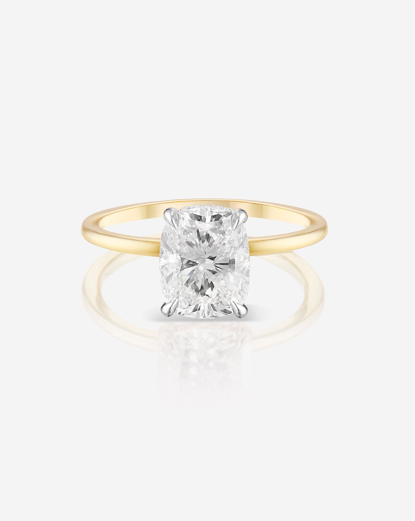 1.50 carat cushion cut lab diamond solitaire ring in a 14kt hallmark yellow gold band. The diamond is set in a classic 4 prong setting.