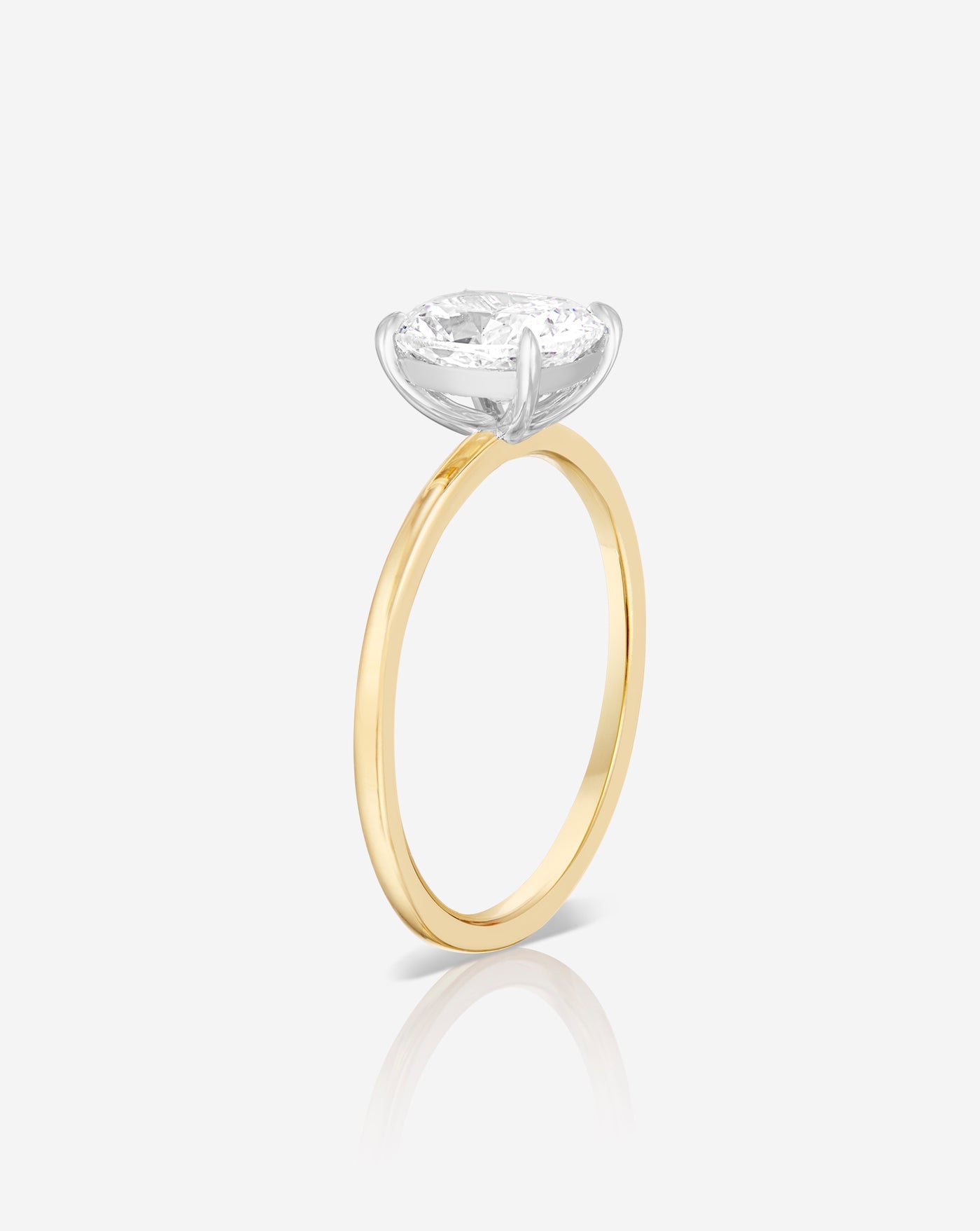 Side profile of a 1.50 carat cushion cut lab diamond solitaire ring in a yellow old band