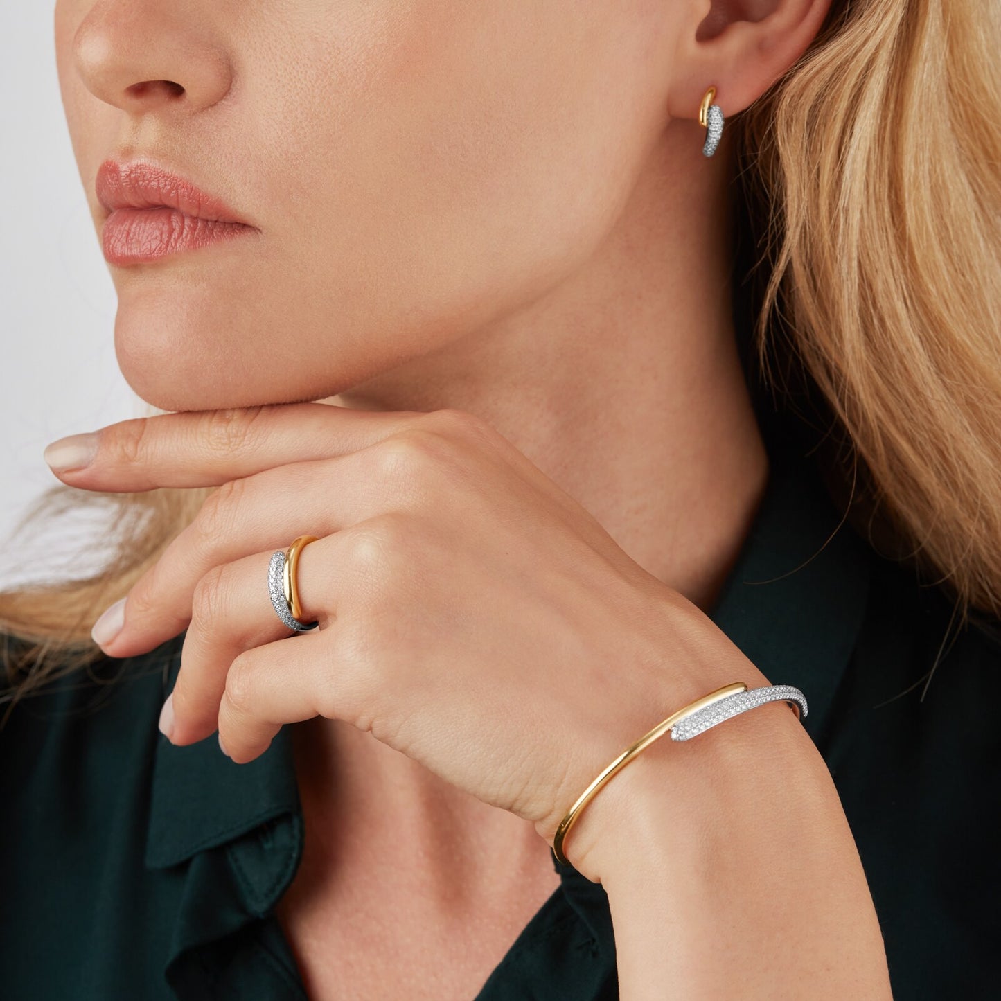1.98 carat pave lab diamond and 14kt hallmark yellow gold bangle on a hand