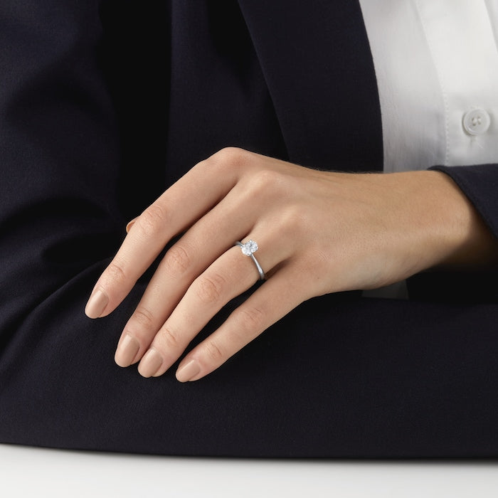 1 carat oval lab-grown diamond solitaire ring in 14kt hallmark white gold band, featuring a classic four-prong setting; sustainable and luxurious engagement jewelry