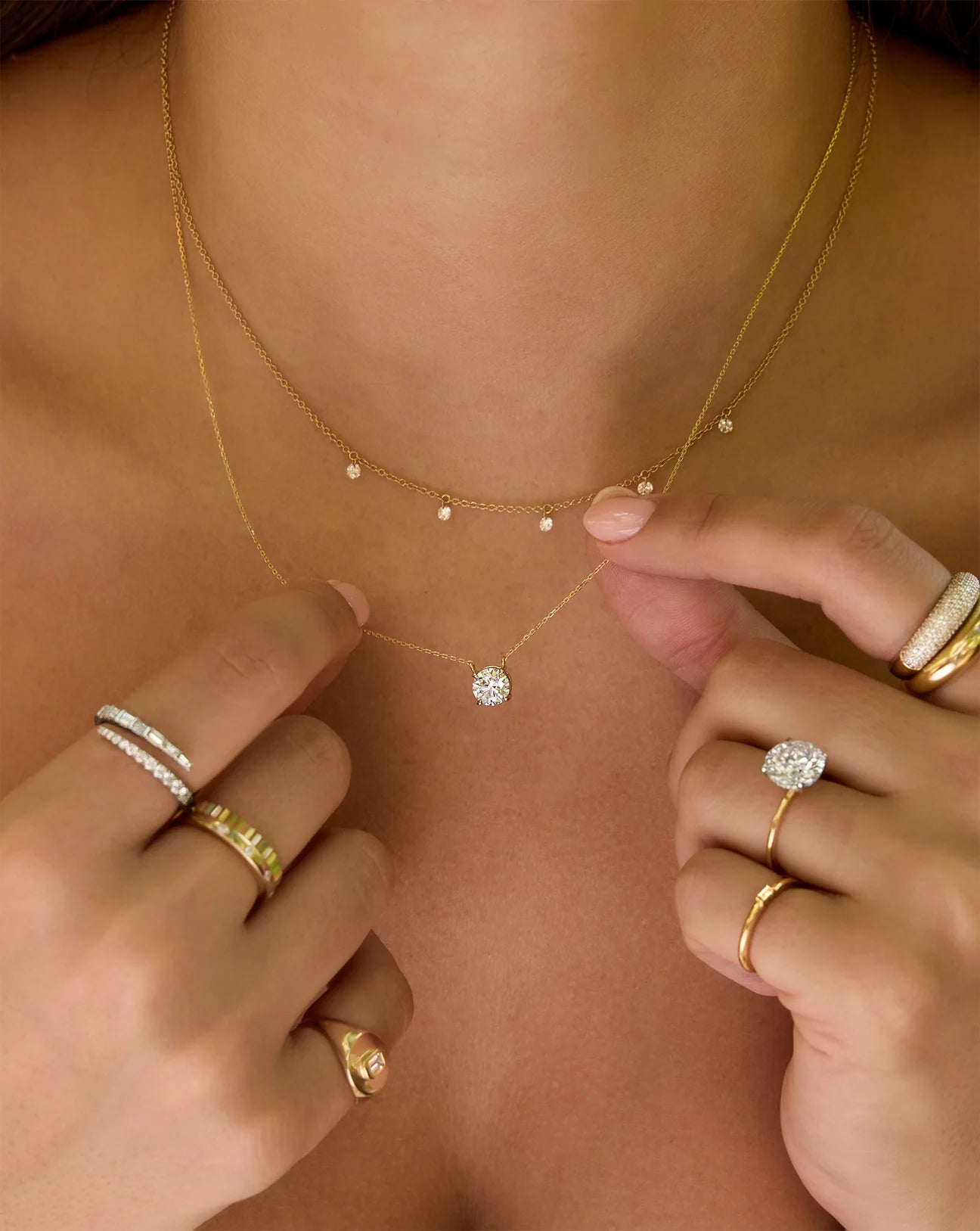 1 ct lab diamond pendant set in 14kt gold necklace, paired and stacked with a dainty multi drop lab diamond gold necklace. Sustainable, ethical luxury jewellery for everyday and special ocassions.
