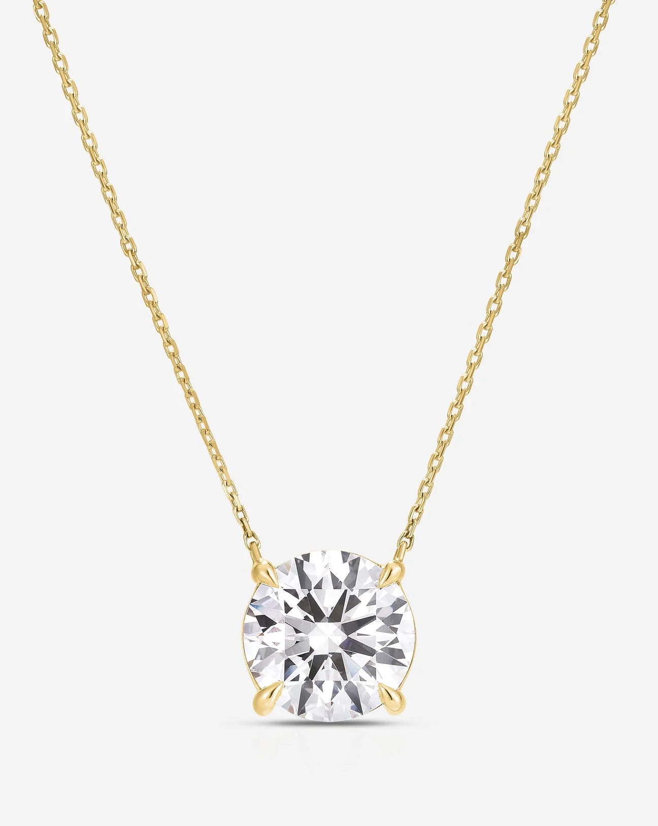 1 carat round lab-grown diamond pendant on a 14kt yellow gold chain. Minimalist solitaire setting, ideal for sustainable, ethical everyday luxury.
