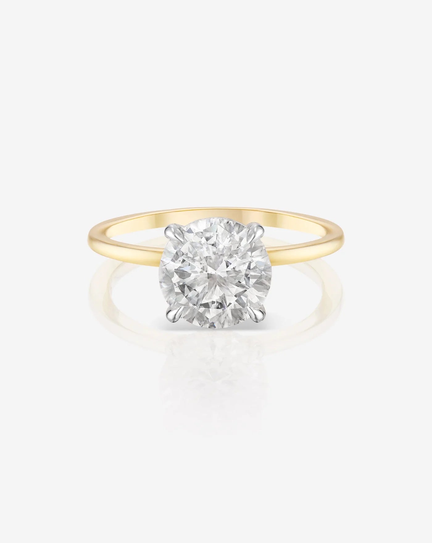 Front view of a 2 carat lab diamond solitaire ring in a yellow gold band. The image shows the diamond’s cut and clarity.