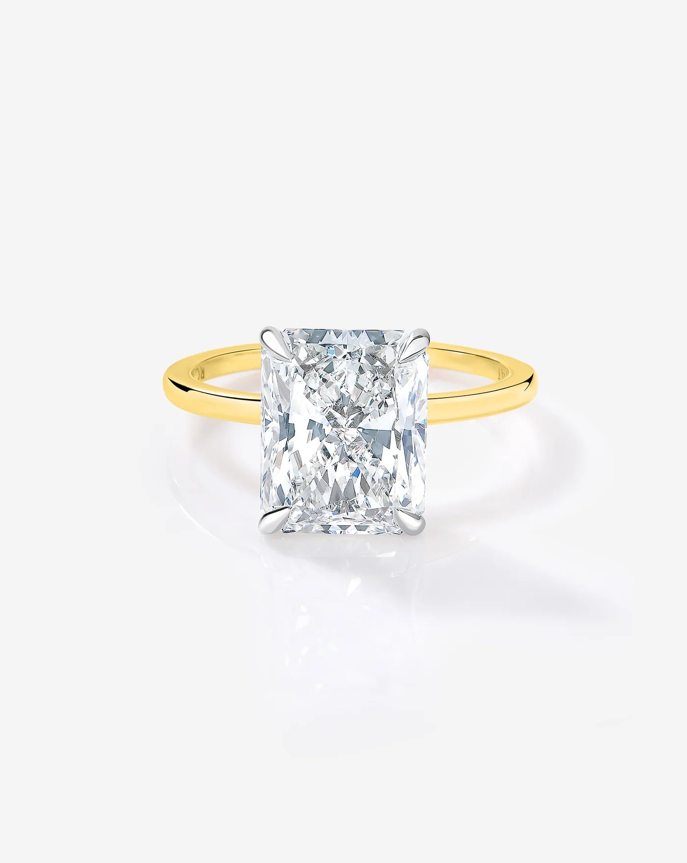 4 carat radiant cut lab diamond solitaire ring in a 14kt hallmark gold band showcasing the cut and clarity of the diamond as seen from above