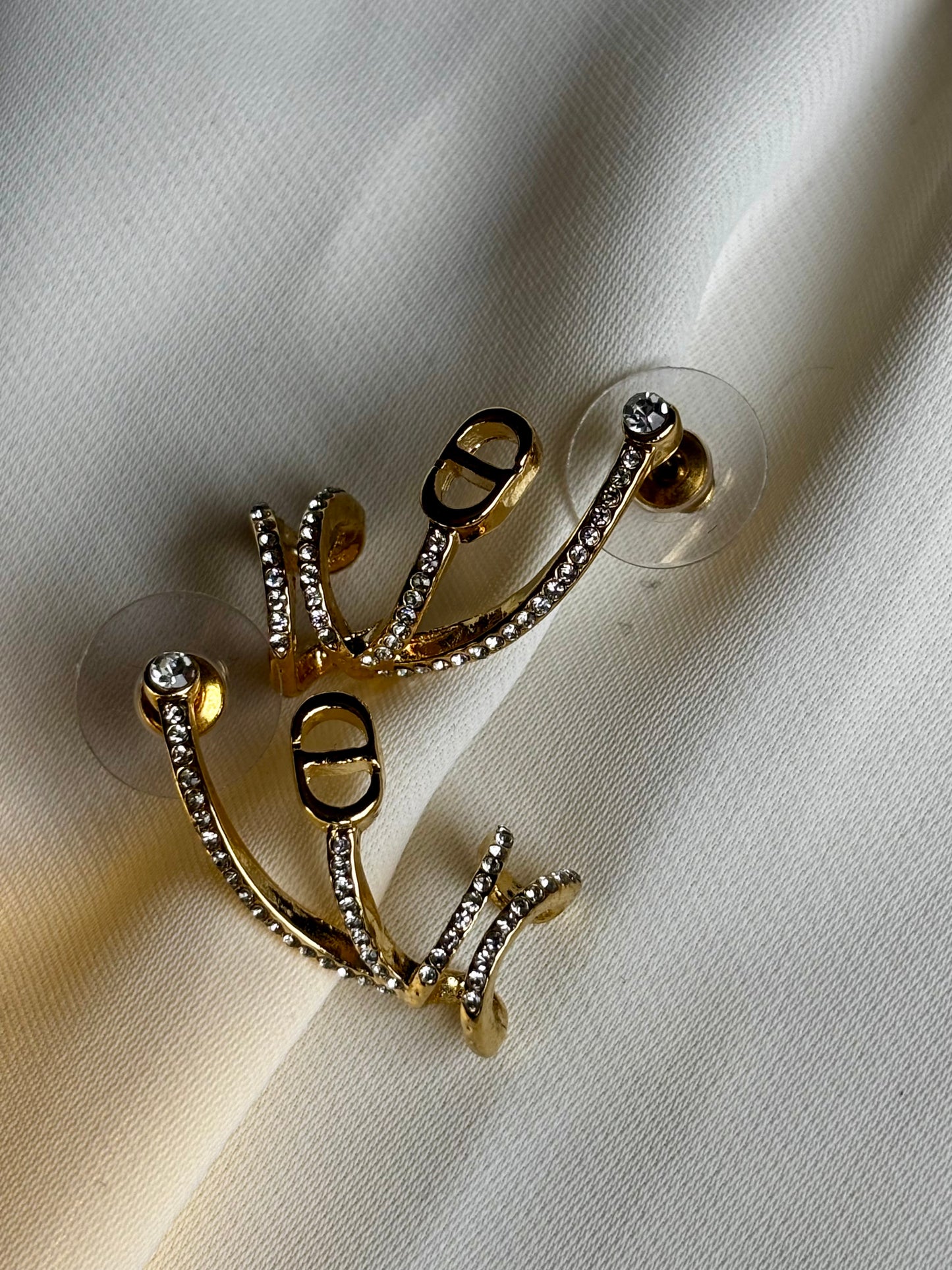 Cd ear climber earrings made with 92.5 Sterling silver and 18kt gold plating with moissanite stones
