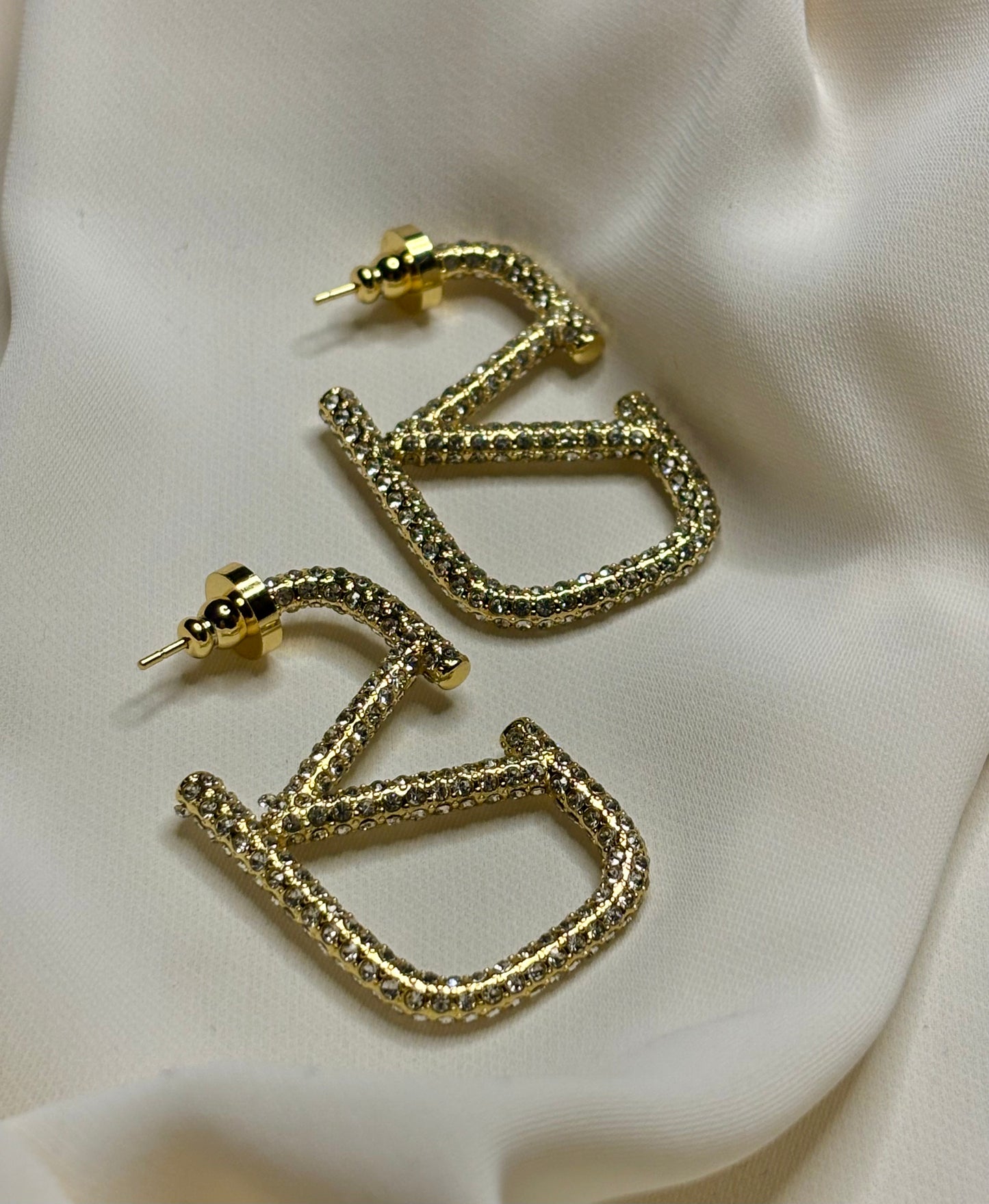 Crystal v logo hoop earrings made in 92.5 Sterling silver with 18kt gold plating