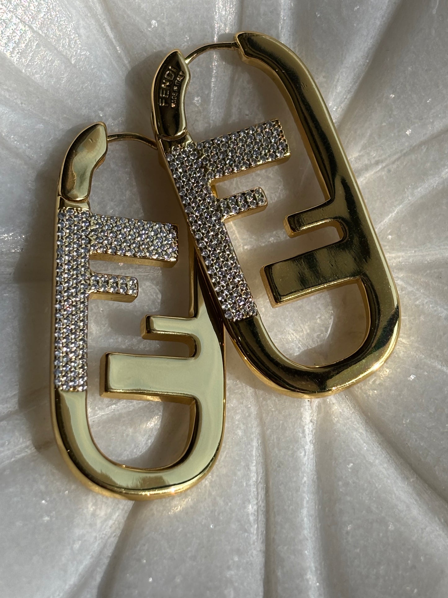 F initial gold tone hoop earrings made with 92.5 Sterling silver and 18kt gold plating with moisanite stones