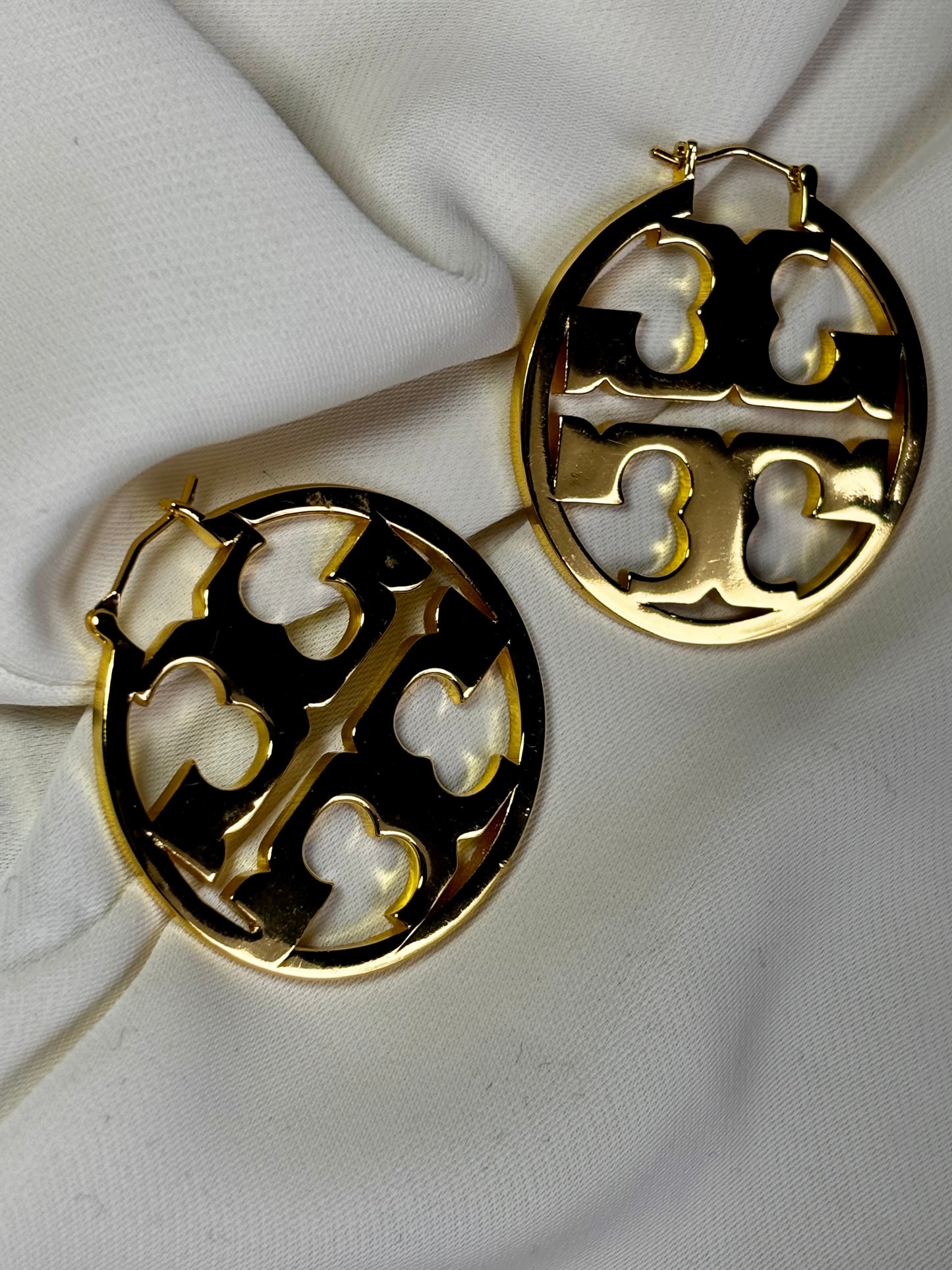 TT, initial gold tone hoop earrings made with 92.5 sterling silver and 18 karat gold plating, the hoops are reversible can be worn Both ways. Anti- tarnish and waterproof.