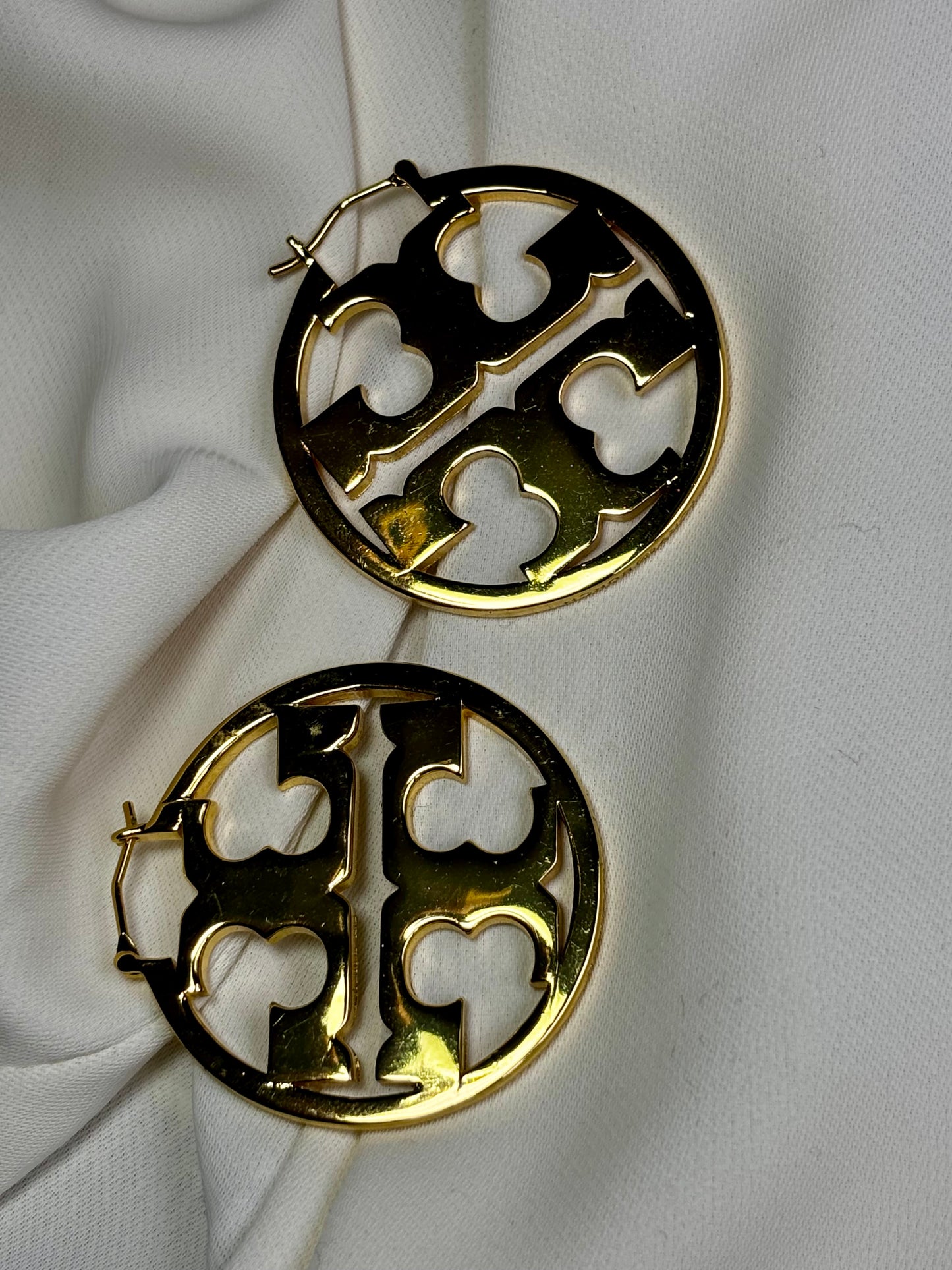 DoubleTree initial hoop earrings made with 92.5 sterling silver in 18 karat gold plating. Anti-tarnish and waterproof. Reversible.