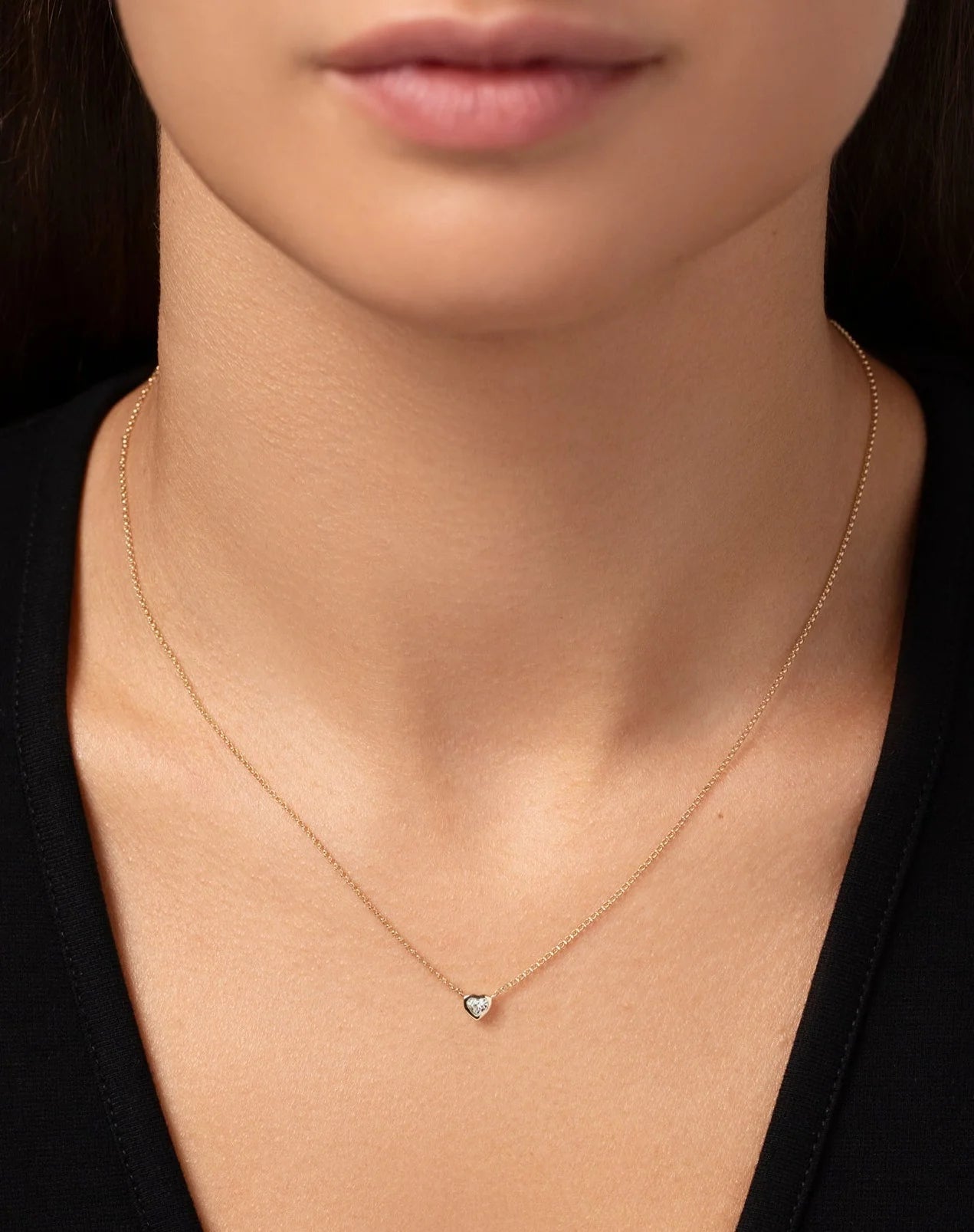 Half carat heart shape lab diamond pendant in a 9 karat hallmark yellow gold chain