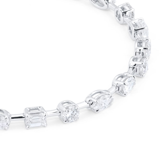 Close up of the mixed shapes of lab diamond tennis bracelet. The diamonds can be seen closely to mark the cut, clarity and setting of the bracelet in 14kt hallmark white gold.