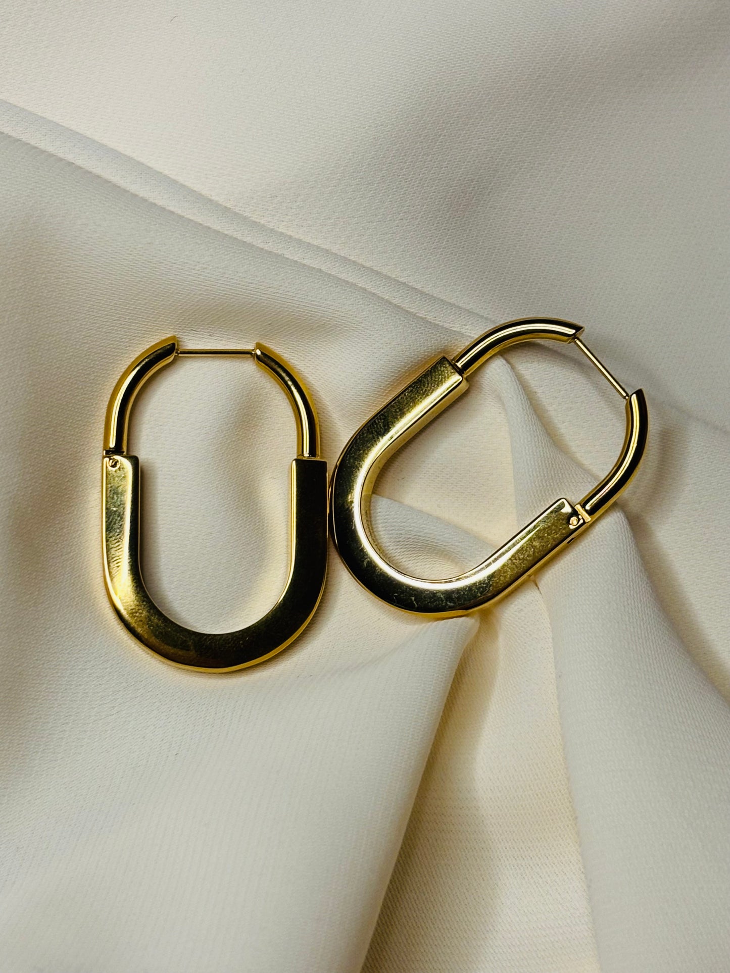 Oval hoop earrings made in 92.5 Sterling silver with 18kt gold plating