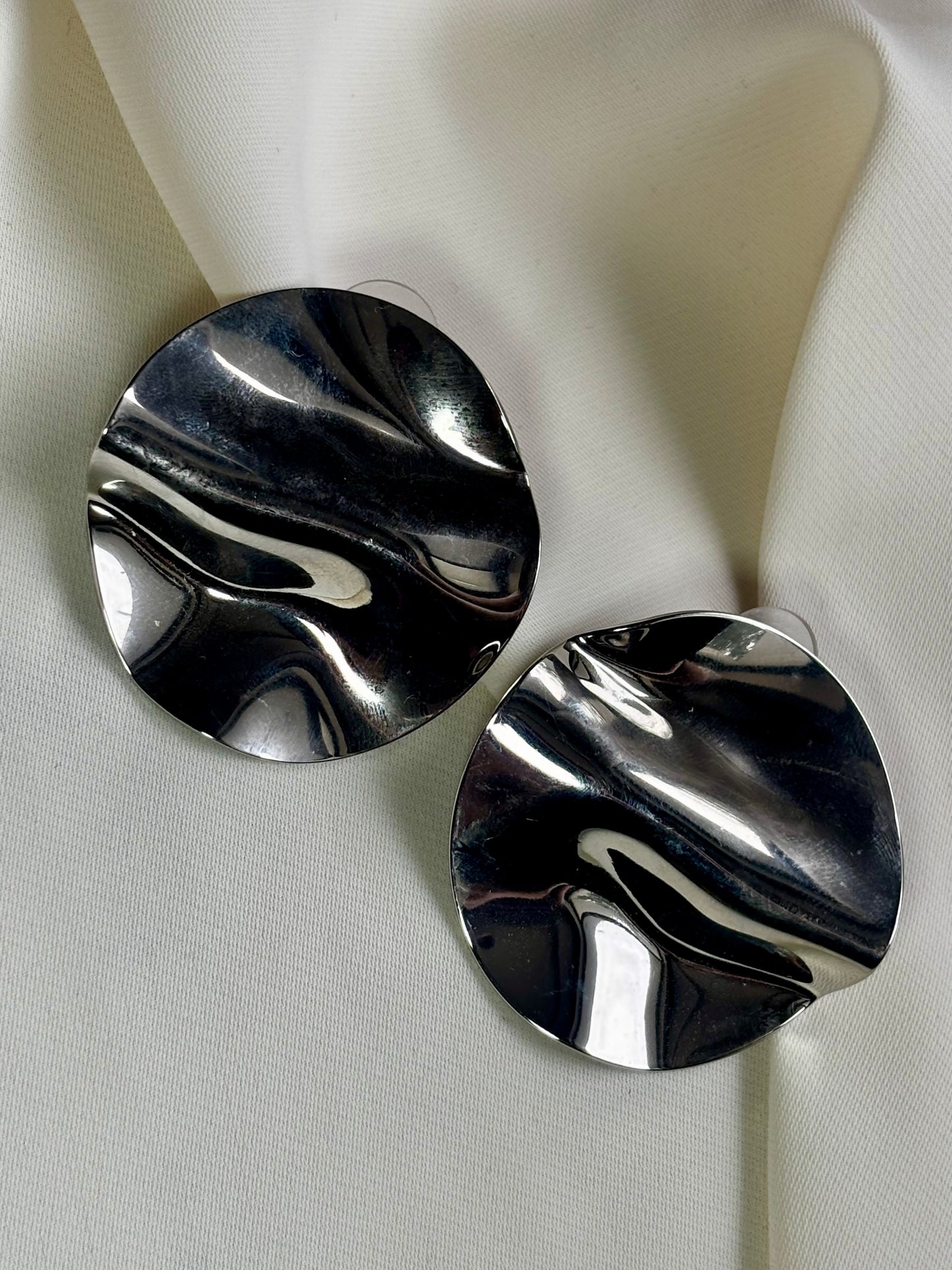 Statement disc earrings made with 92.5 sterling silver, and 18 carat white gold plating. Anti tarnish and waterproof.