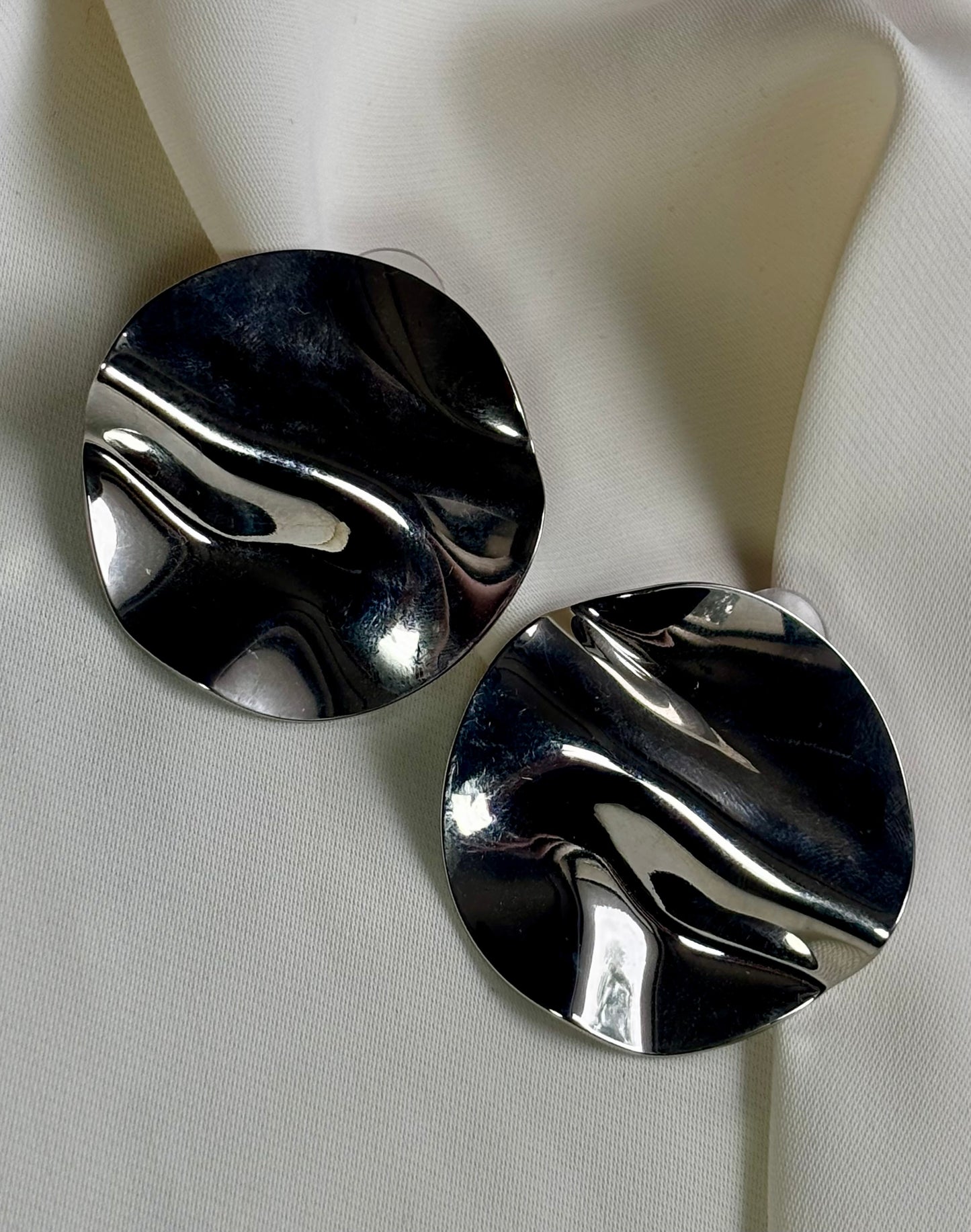 Statement disc silver tone earrings made with 92.5 sterling silver and 18 carat white gold plating. Anti Tarnish and waterproof.