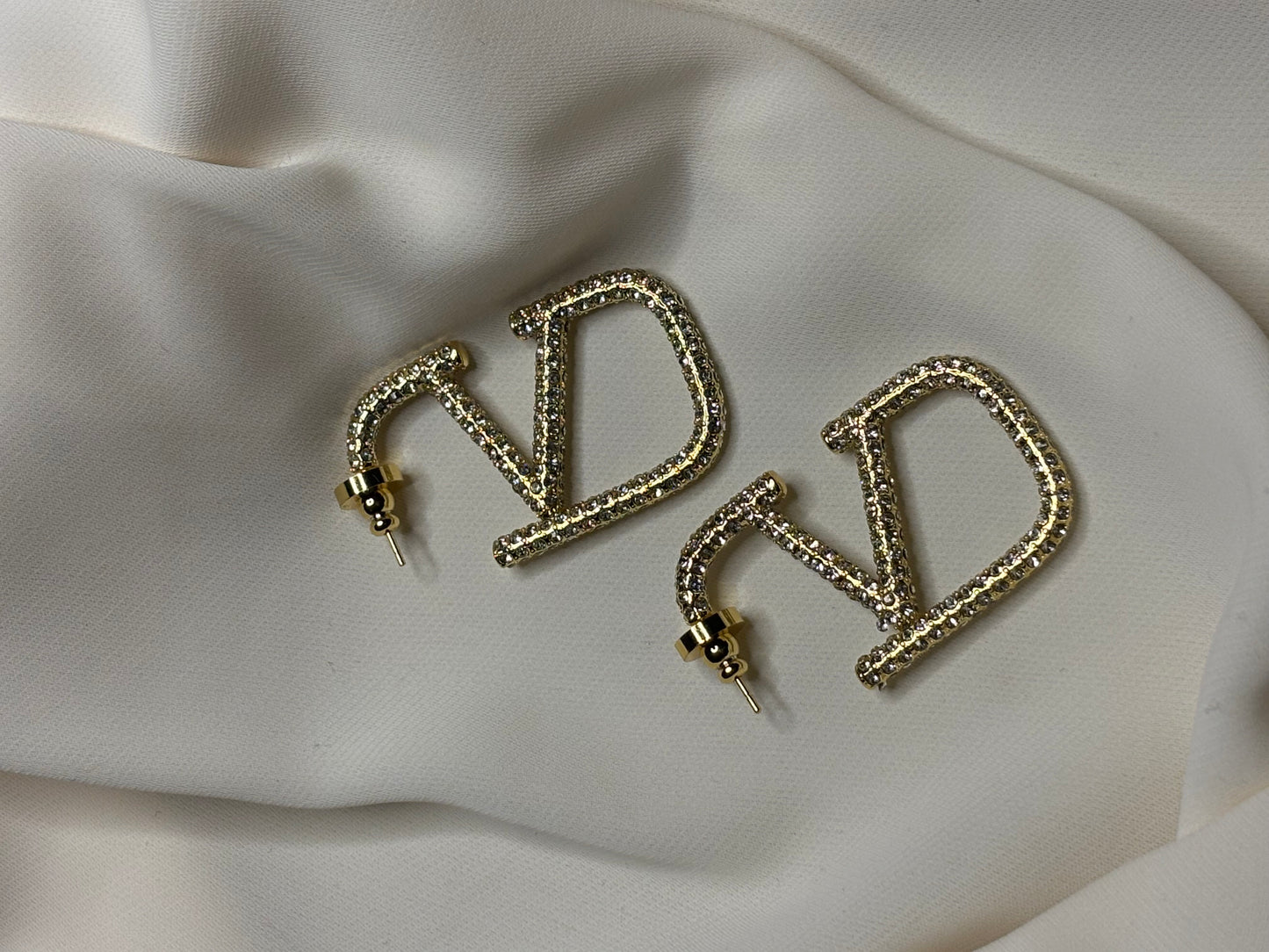 V logo crystal hoop earrings made in 92.5 Sterling silver with 18kt gold plating