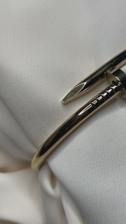 Nail design bracelet made with 92.5 sterling silver, and 18 karat gold plating. Anti- tarnish and waterproof.