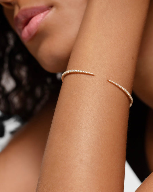 Delicate diamond claw bracelet set in 14kt hallmark yellow gold.