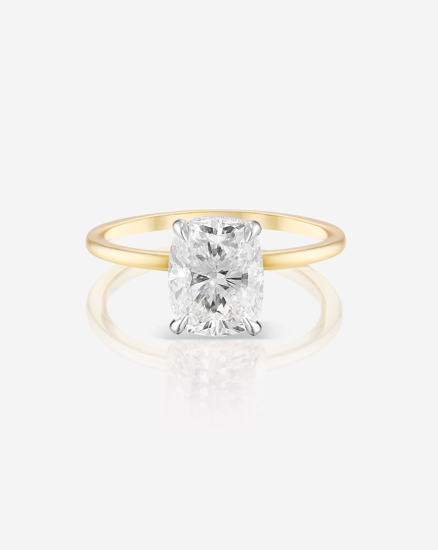1.50 carat cushion cut lab diamond solitaire ring in a 14kt hallmark yellow gold band.  The diamond is set in a classic 4 prong setting.