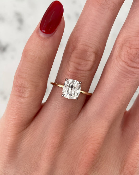 1.50 ct cushion cut lab diamond ring in  14kt hallmark gold band set with 4 prongs.The ring showases exceptional cut ad sparkle.