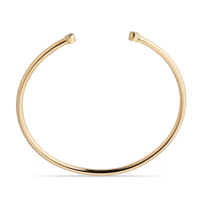 Front view of 14kt hallmark yellow gold and 0.36 carat lab diamond claw bangle