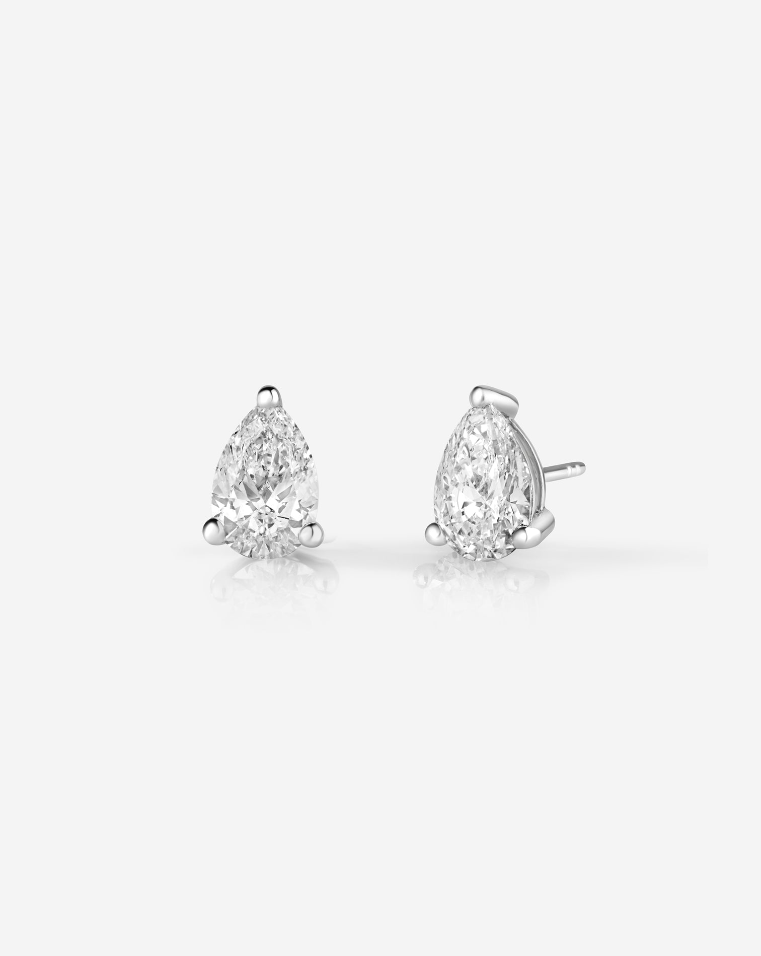 6CT Pair Pear Lab Diamond Stud Earrings in 14kt hallmark white gold. The studs show brilliant cut and clarity and are set with 3 white gold prongs. The studs are an embodiment of sustainable, ethical luxury accessory.