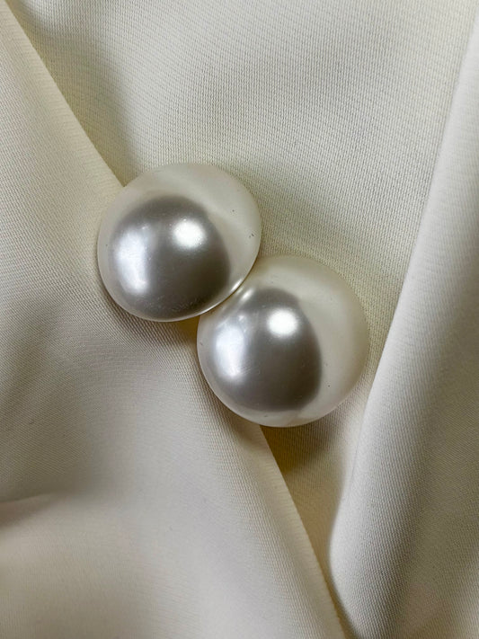 Big statement round pearl studs.