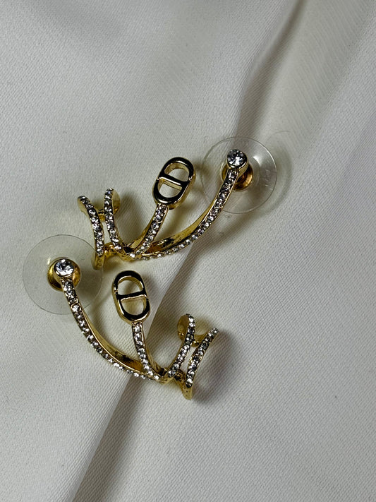 C and D Logo earrings made in 92.5 Sterling silver with 18kt gold plating and moissanite stones