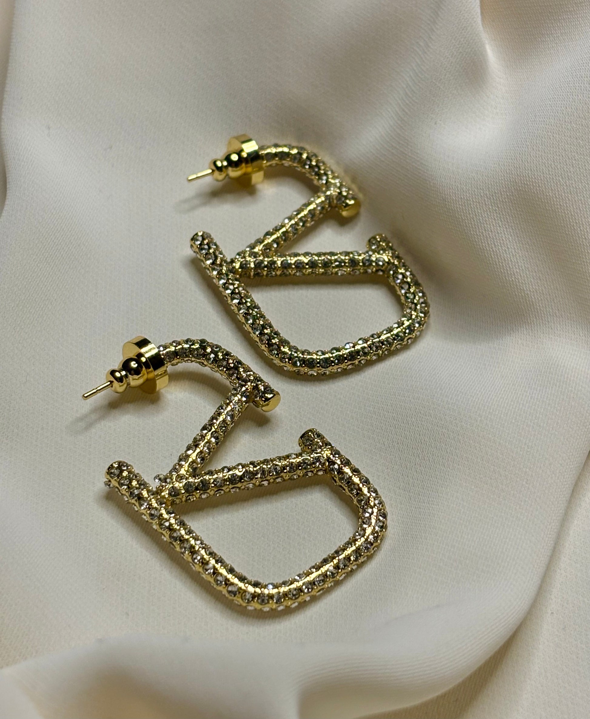 Crystal v logo hoop earrings made in 92.5 Sterling silver with 18kt gold plating