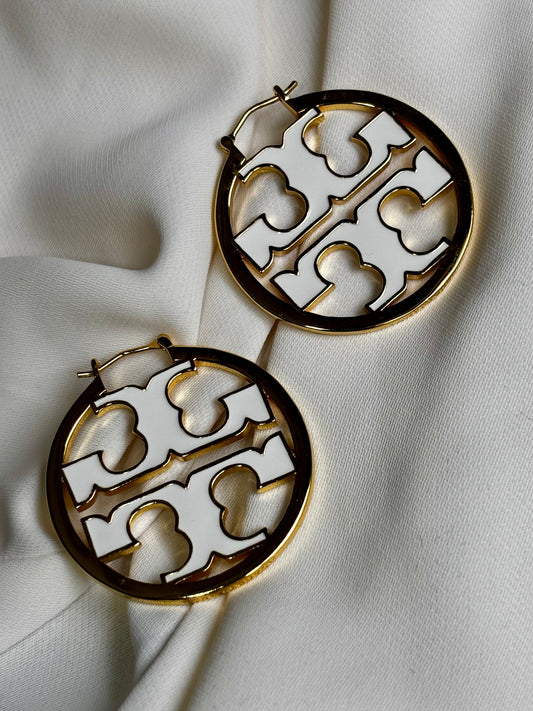 TT, initial hoop earrings made with 92.5 sterling silver in 18 karat gold plating. Tanish and waterproof.