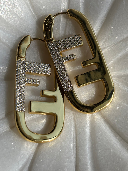 F initial gold tone hoop earrings made with 92.5 Sterling silver and 18kt gold plating with moisanite stones