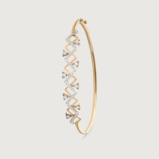 The image shows a 14kt  hallmark gold  bangle with a geometric pattern of lab diamonds