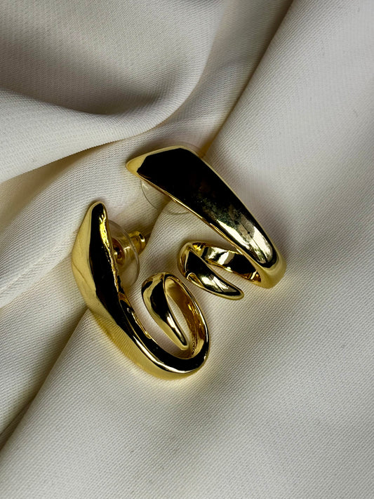 Sculpted twist earrings made with 92.5 sterling silver in 18 carat gold plating. Anti tarnish and waterproof.