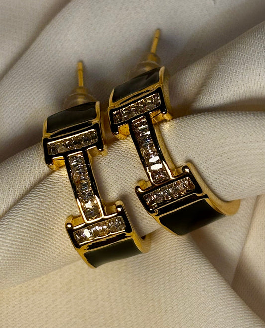 H initial hoops with moissanite stones and black enamel made  in 92.5 Sterling silver with 18kt gold plating.