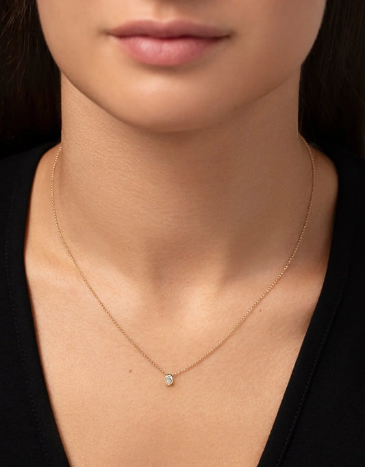 Half carat oval shape lab diamond pendant in bezel setting in a 9 karat hallmark yellow gold chain
