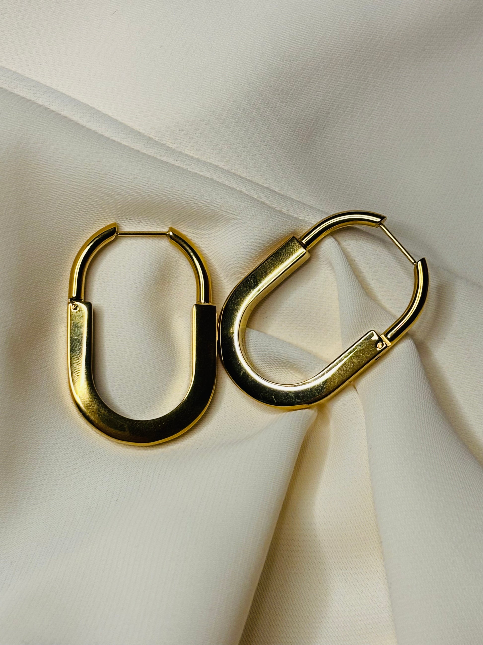 Oval hoop earrings made in 92.5 Sterling silver with 18kt gold plating