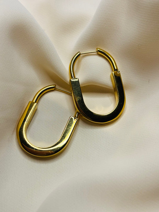 Sculpted gold tone hoop earrings made in 92.5 sterling silver with 18kt gold plating