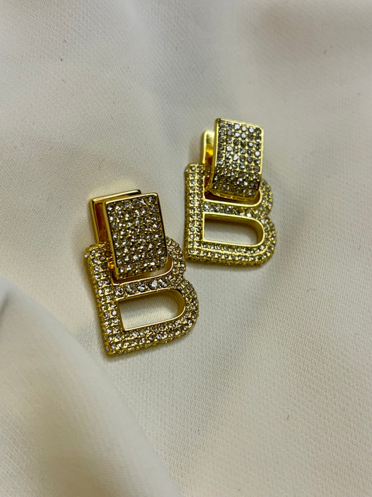 B initial drop earrings made in 92.5 Sterling silver with 18kt gold plating and moissanite stones