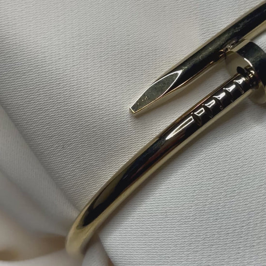 Nail design bracelet made with 92.5 sterling silver, and 18 karat gold plating. Anti- tarnish and waterproof.