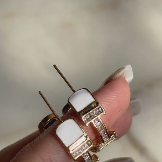 H initial hoop earrings made with 92.5 Sterling silver and 18kt gold plating, set with moissanite stones and white enamel