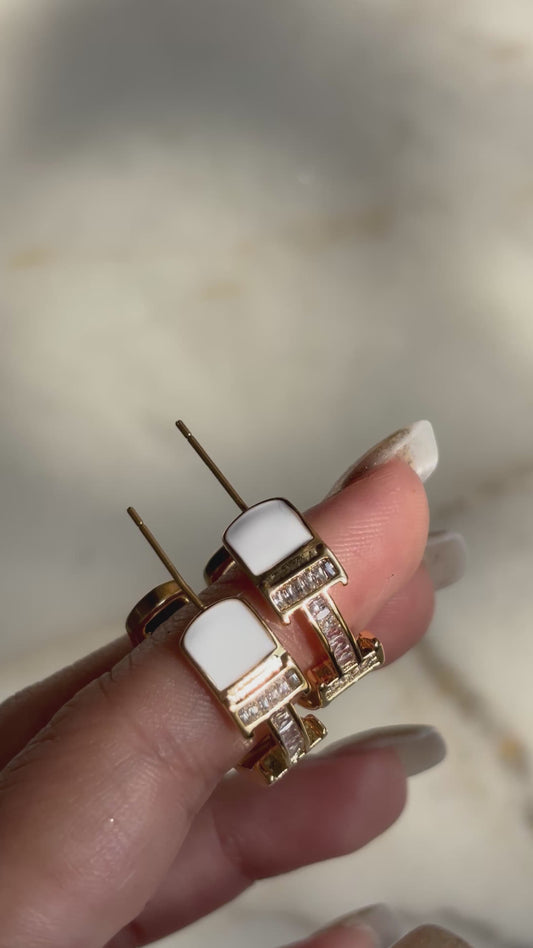 H initial hoop earrings made with 92.5 Sterling silver and 18kt gold plating, set with moissanite stones and white enamel